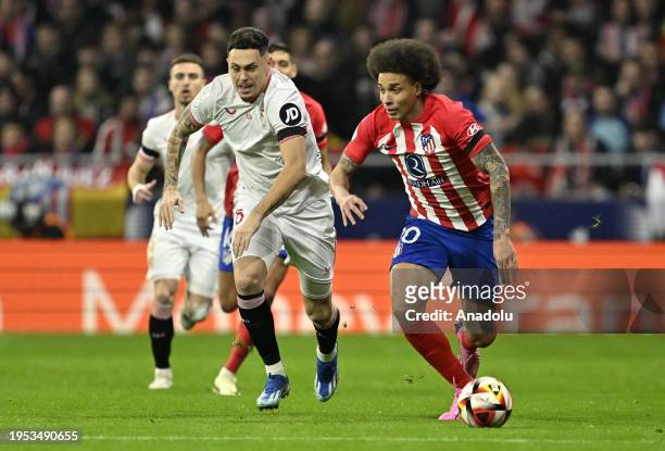 Axel Witsel of Atletico Madrid and Lucas Ocampos of Sevilla compete during the Copa del Rey Quarter-Final match between Atletico Madrid and Sevilla...