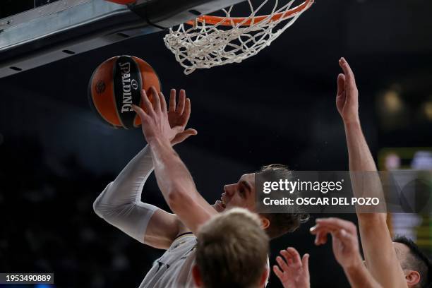 Real Madrid's Croatian forward Mario Hezonja attempts a shot during the Euroleague round 23 basketball match between Real Madrid Baloncesto and...