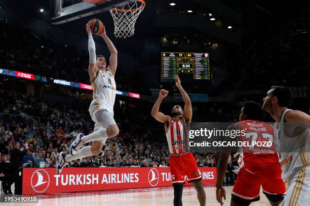 Real Madrid's Croatian forward Mario Hezonja attempts a shot during the Euroleague round 23 basketball match between Real Madrid Baloncesto and...
