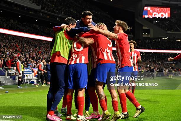 Atletico Madrid's Dutch forward Memphis Depay celebrates scoring his team's first goal with teammates during the Spanish Copa del Rey quarter final...