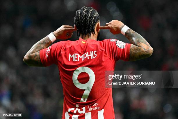 Atletico Madrid's Dutch forward Memphis Depay celebrates scoring his team's first goal during the Spanish Copa del Rey quarter final football match...