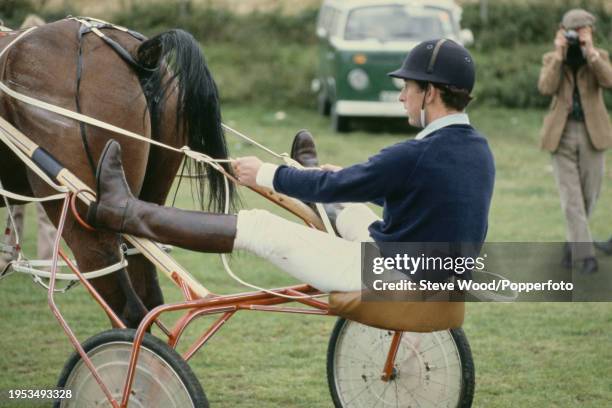 Prince Charles practicing harness racing in a "sulky" after a polo match in Fife, Scotland in September, 1978.