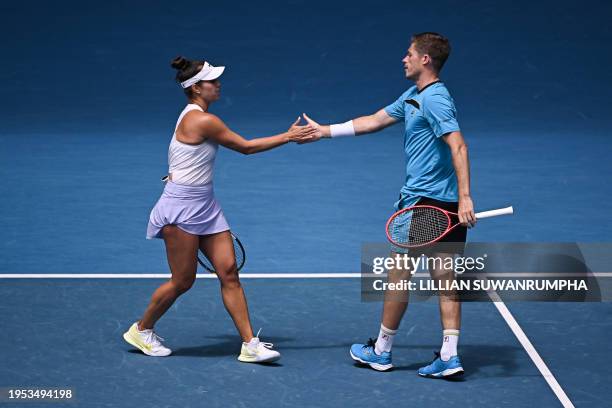 Britain's Neal Skupski shakes hands with partner Desirae Krawczyk of the US during their mixed doubles final match against Poland's Jan Zielinski and...