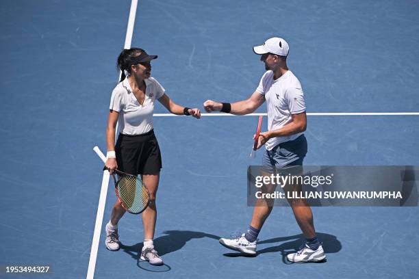 Poland's Jan Zielinski and partner Su-wei Hsieh of Taiwan react after a point against Britain's Neal Skupski and partner Desirae Krawczyk of the US...