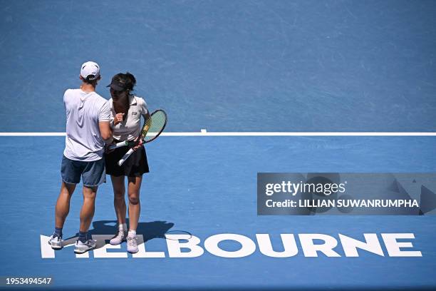 Poland's Jan Zielinski and partner Su-wei Hsieh of Taiwan discuss tactics during their mixed doubles final match against Britain's Neal Skupski and...