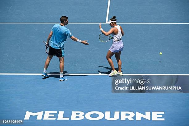 Britain's Neal Skupski shakes hands with partner Desirae Krawczyk of the US during their mixed doubles final match against Poland's Jan Zielinski and...