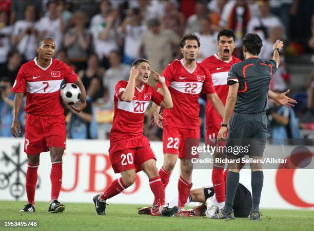 June 25: Turkey Players Mehmet Aurelio, Sabri Sarioglu, Hamit Altintop and Gokhan Zan Appeal to Referee during the UEFA Euro 2008 Semi Final match...