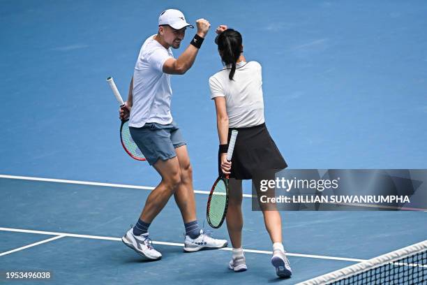 Taiwan's Su-wei Hsieh and partner Jan Zielinski of Poland celebrate winning the second set against Britain's Neal Skupski and partner Desirae...