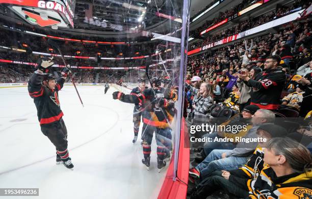 Vladimir Tarasenko of the Ottawa Senators celebrates his third period goal against the Boston Bruins with teammates Josh Norris, Jakob Chychrun, Josh...