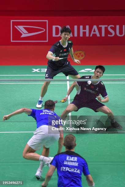 China's Liu Yuchen/Ou Xuanyi compete during the men's doubles first round match between Denmark's Rasmus Kjaer/Frederik Sogaard and China's Liu...