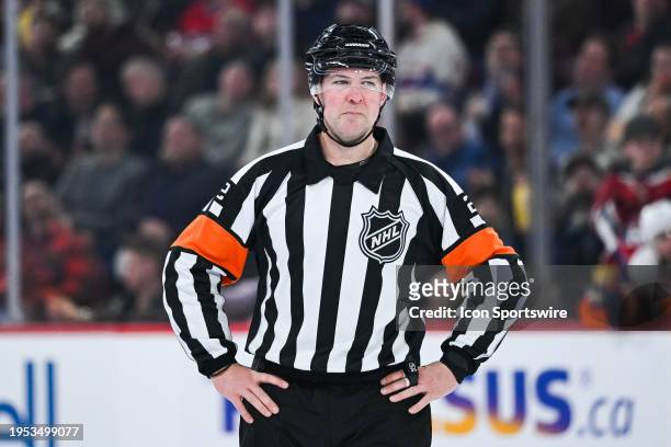 Referee Jon McIsaac waits for the play to resume during the New York Islanders versus the Montreal Canadiens game on January 25 at Bell Centre in...
