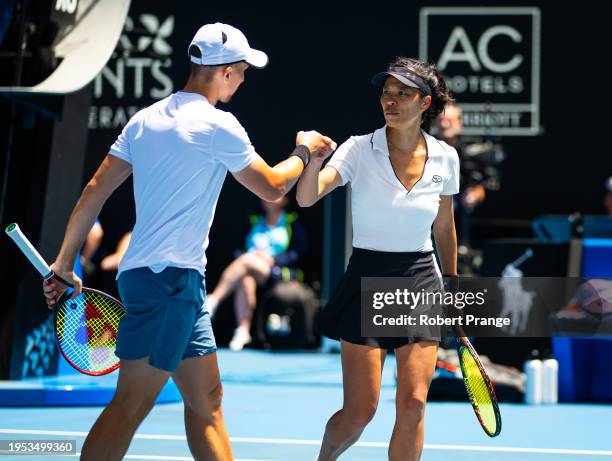 Su-Wei Hsieh of Chinese Taipeh and Jan Zielinski of Poland react in their match against Desirae Krawczyk of the United States and Neal Skupski of...