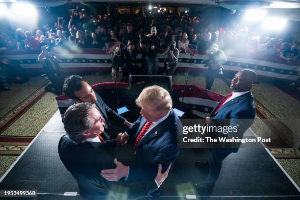 Laconia, NH Republican presidential candidate and former president Donald Trump speaks with Vivek Ramaswamy, North Dakota Gov. Doug Burgum, and Sen....