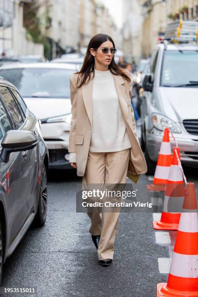 Deborah Reyner Sebag wears beige suit outside Georges Hobeika during the Haute Couture Spring/Summer 2024 as part of Paris Fashion Week on January...