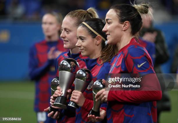 Aitana Bonmati is offering The Best trophy, while Keira Walsh and Lucy Bronze are presenting the FIFA FIFPRO Women's World 11 trophy to the fans...