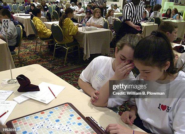 Players plan their moves as they participate in the National School Scrabble Tournament April 26, 2003 in Boston, Massachusetts. More than 200 middle...