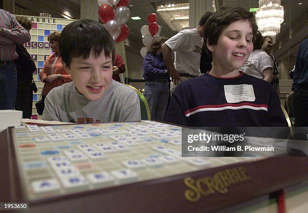 Nick Amphlett and John Ezekowitz, both 12-years-old, react to their victory at the National School Scrabble Championship April 26, 2003 in Boston,...