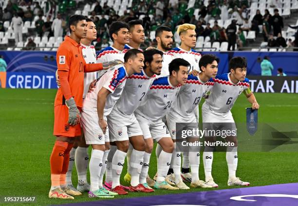 The Thailand national team players are posing for a team photo before the AFC Asian Cup 2023 match between Saudi Arabia and Thailand at Education...
