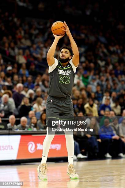 Karl-Anthony Towns of the Minnesota Timberwolves shoots against the Charlotte Hornets in the second quarter at Target Center on January 22, 2024 in...