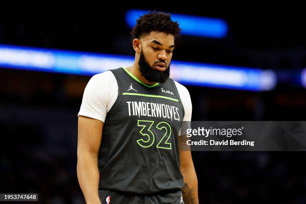Karl-Anthony Towns of the Minnesota Timberwolves looks on against the Charlotte Hornets in the second quarter at Target Center on January 22, 2024 in...