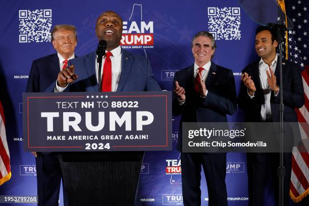 Sen. Tim Scott speaks as Republican presidential candidate and former President Donald Trump , North Dakota Governor Doug Burgum and Vivek Ramaswamy...