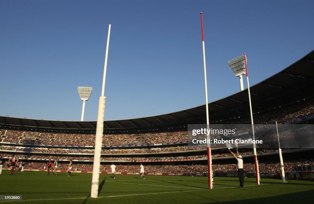 The goal umpire signals a goal 