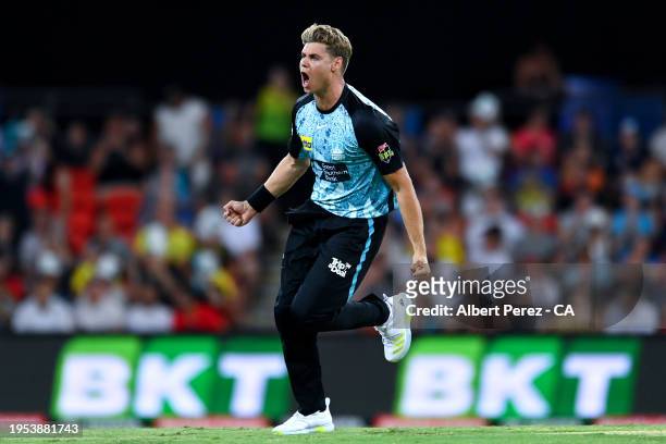 Spencer Johnson of the Heat celebrates dismissing D'Arcy Short of the Strikers during the BBL The Challenger Final match between Brisbane Heat and...