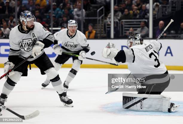 David Rittich of the Los Angeles Kings makes a glove save in front of Drew Doughty during the first period against the San Jose Sharks at Crypto.com...