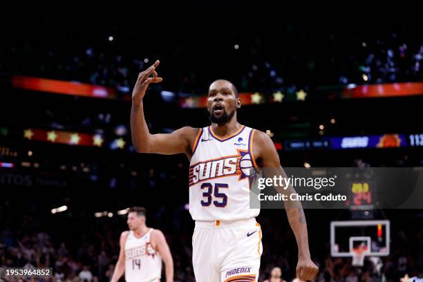 Kevin Durant of the Phoenix Suns reacts after hitting a three point shot against the Chicago Bulls during the second half at Footprint Center on...
