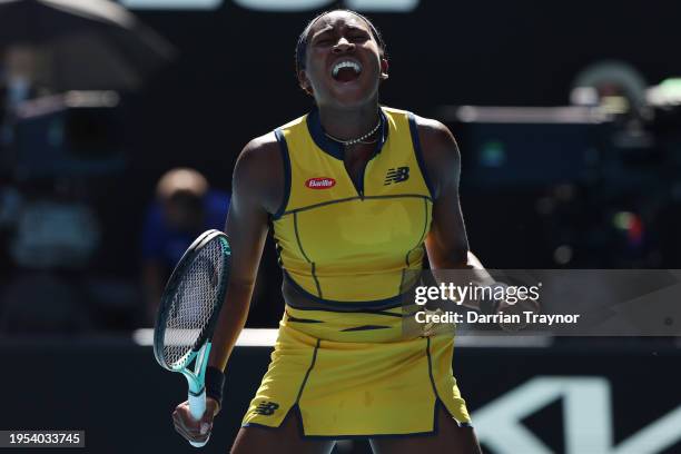 Coco Gauff of the United States celebrates winning match point in their quarterfinals singles match against Marta Kostyuk of Ukraine during the 2024...