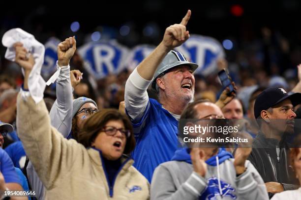 Detroit Lions fans cheer in the stands during an NFL divisional round playoff football game against the Tampa Bay Buccaneers at Ford Field on January...