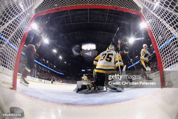 Juuso Valimaki of the Arizona Coyotes celebrates with Nick Bjugstad after scoring a goal against goaltender Tristan Jarry of the Pittsburgh Penguins...