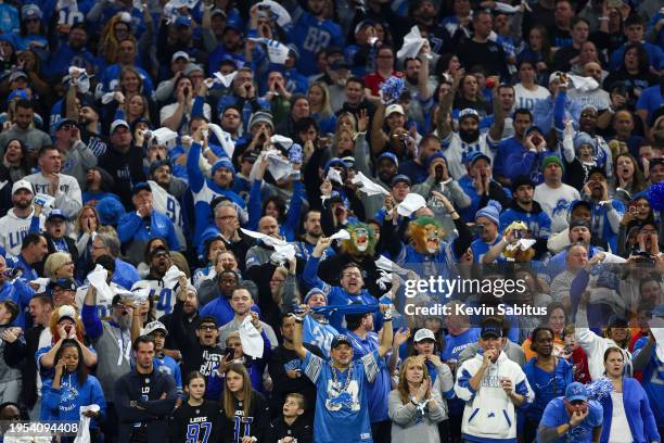 Detroit Lions fans cheer during an NFL divisional round playoff football game against the Tampa Bay Buccaneers at Ford Field on January 21, 2024 in...