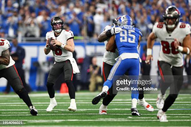 Baker Mayfield of the Tampa Bay Buccaneers drops back to pass during an NFL divisional round playoff football game against the Detroit Lions at Ford...