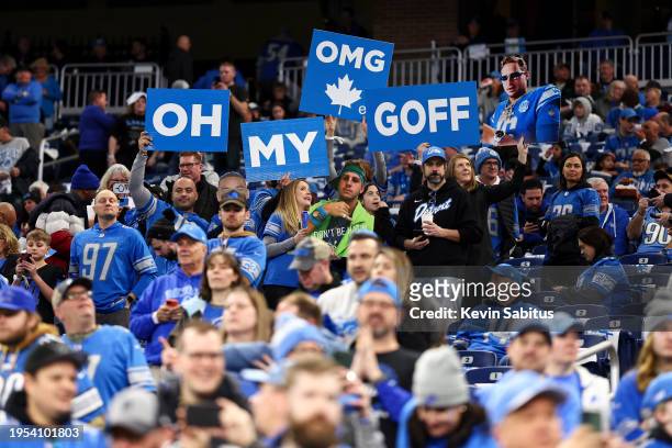 Detroit Lions fans hold up signs for Jared Goff prior to an NFL divisional round playoff football game against the Tampa Bay Buccaneers at Ford Field...