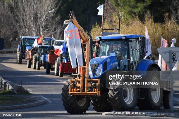 French farmers drive their tractors on the A9 highway towards the prefecture of Montpellier, during a demonstration called by French farmer unions to...