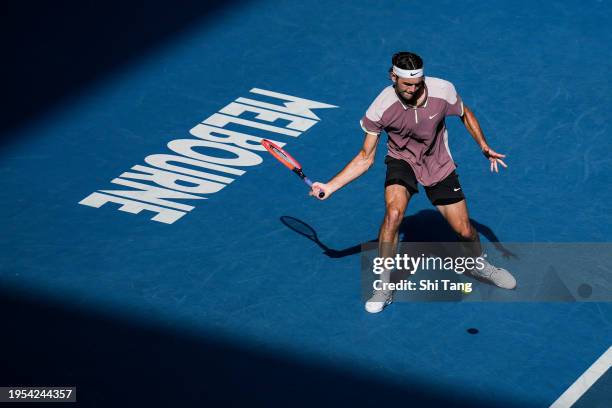 Taylor Fritz of the United States plays a forehand in the Men's Singles Quarter Finals match against Novak Djokovic of Serbia during day ten of the...