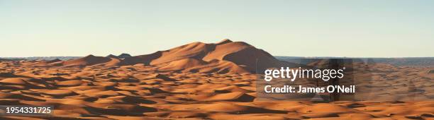 panoramic of sand dunes and clear blue sky - erg chebbi desert stock pictures, royalty-free photos & images