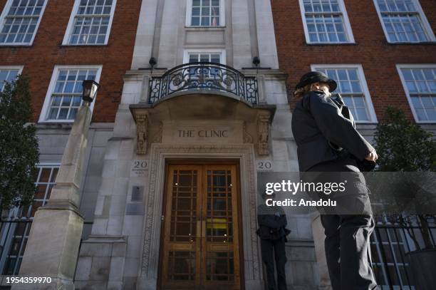 Police officers stand guard outside of the London Clinic hospital, where King Charles III of England to get treatment for an enlarged prostate, in...