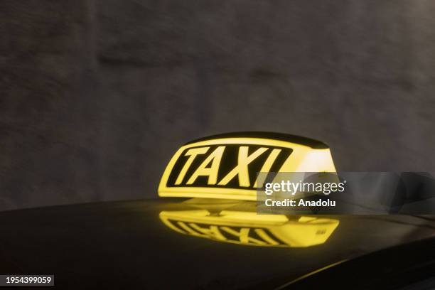 View of a taxi sign at night in Prague, Czech Republic on January 13, 2024.