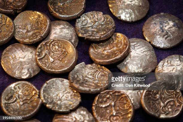 Hoard of 26 Iron Age gold coins that were discovered hidden inside a flint container in West Berkshire, are displayed at the British Museum's...