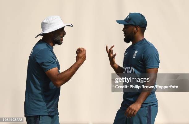 Jeetan Patel and Rehan Ahmed of England talk during the England Net Session at Rajiv Gandhi International Stadium on January 23, 2024 in Hyderabad,...