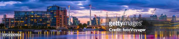london city hall docklands skyscrapers apartments illuminated at sunset panorama - canada tower stock pictures, royalty-free photos & images