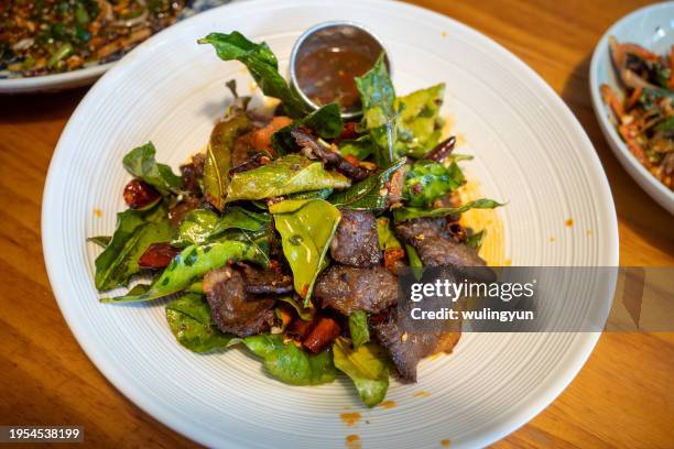 stir-fried beef jerky with lemon leaf - beef jerky stock pictures, royalty-free photos & images