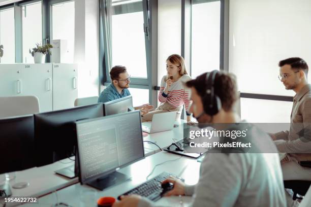 database programmer writing code - programmer team stock pictures, royalty-free photos & images