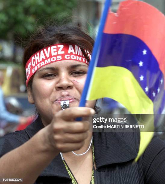 Supporter of Hugo Chavez celebrates at the Palacio de Miraflores in honor of the president, in Caracas, 14 April 2002. Una simpatizante de Hugo...