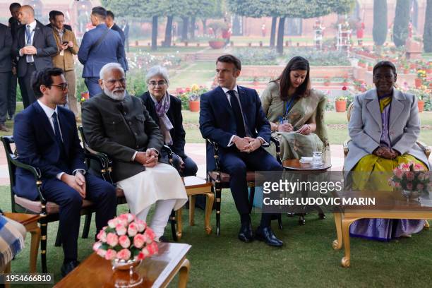 France's President Emmanuel Macron sits with his Indian counterpart Droupadi Murmu , India's Prime Minister Narendra Modi and France's Minister for...