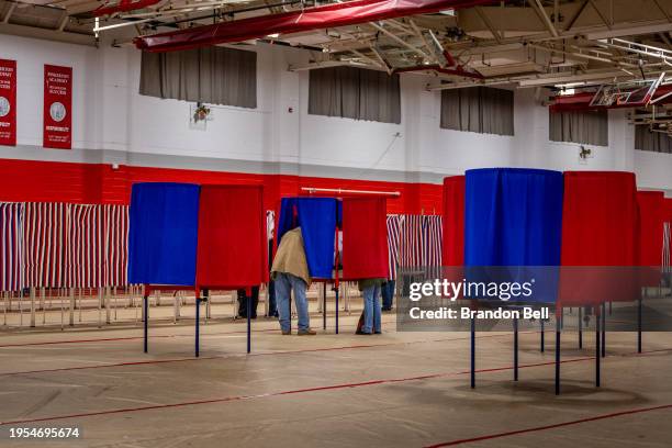 Voters cast their ballots in the New Hampshire Primary at Pinkerton Academy on January 23, 2024 in Derry, New Hampshire. People around the state are...