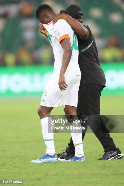 Karim Konaté of Ivory Coast is comforted after the TotalEnergies CAF Africa Cup of Nations group stage match between Equatorial Guinea and Ivory...