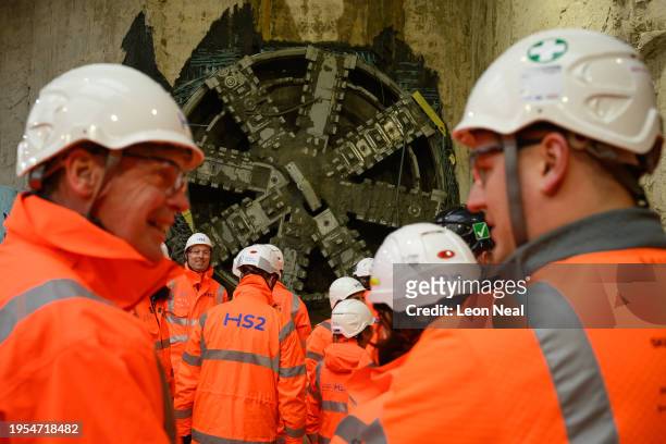 Construction workers look on after Lydia, an 847 tonne tunnel boring machine broke through into the underground box at HS2's Old Oak Common station...